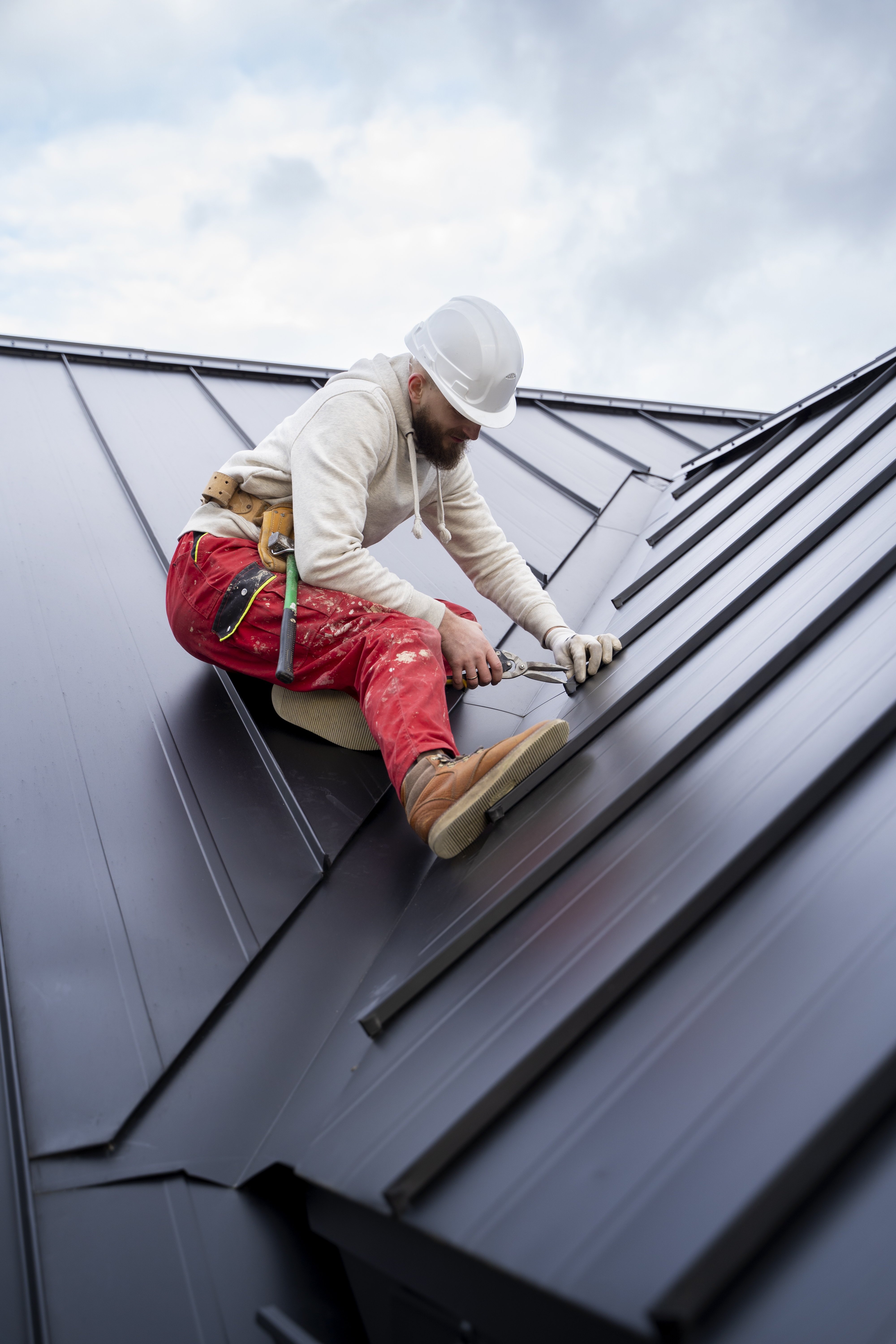 Experienced roofing professional working on a roof